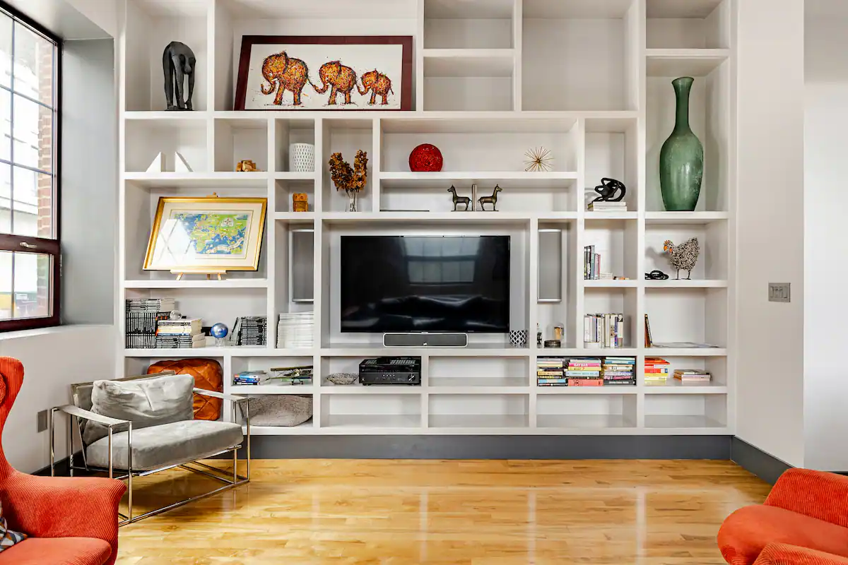 Curated bookshelf with art objects